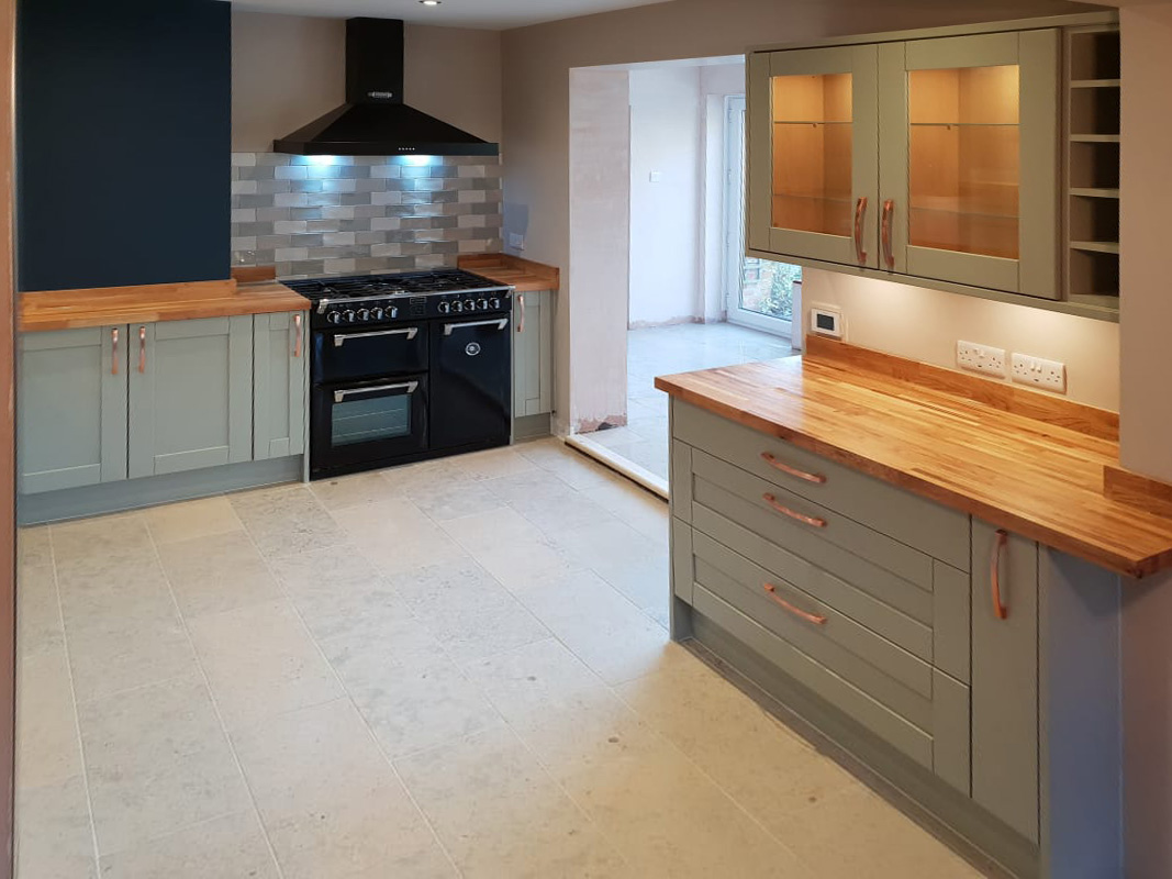 Halton Property Service; Country kitchen featuring a black Aga