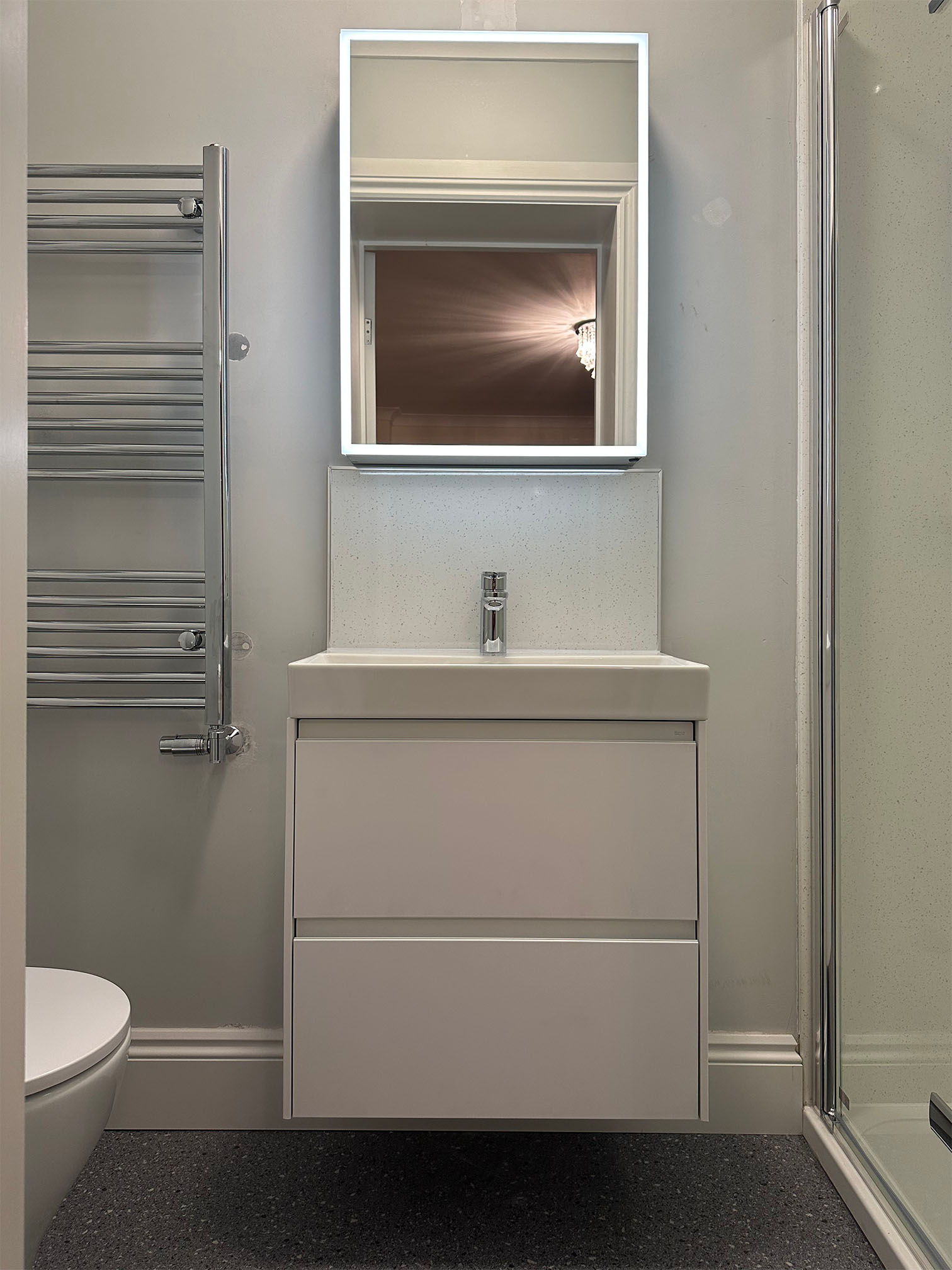 Halton Property Services; Sink, Illuminated Mirror and Shower Panel surround